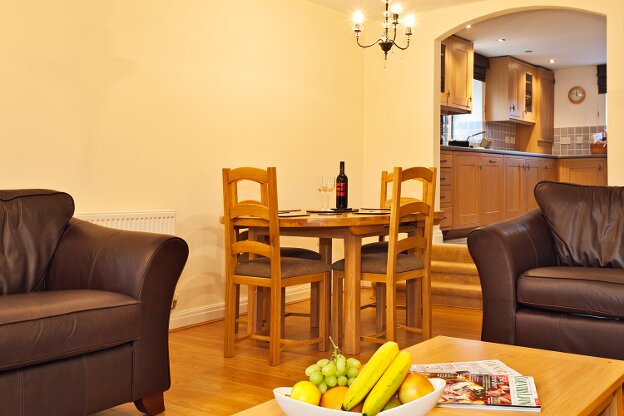 The spacious lounge leads up to the kitchen and the entrance hall.