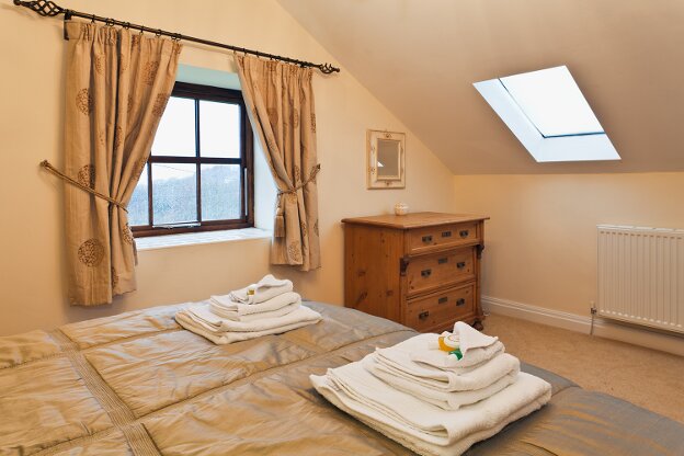 The master bedroom enjoys a wonderful view of the local countryside.